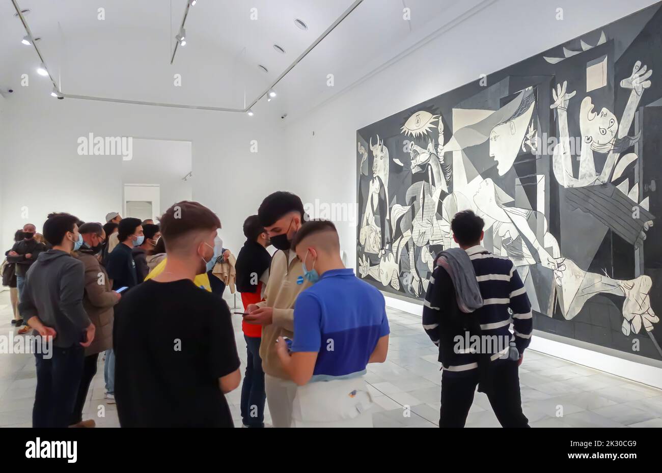 Visitors looking at Pablo Picasso's Guernica painting in Reina Sofia museum Madrid, Spain Stock Photo