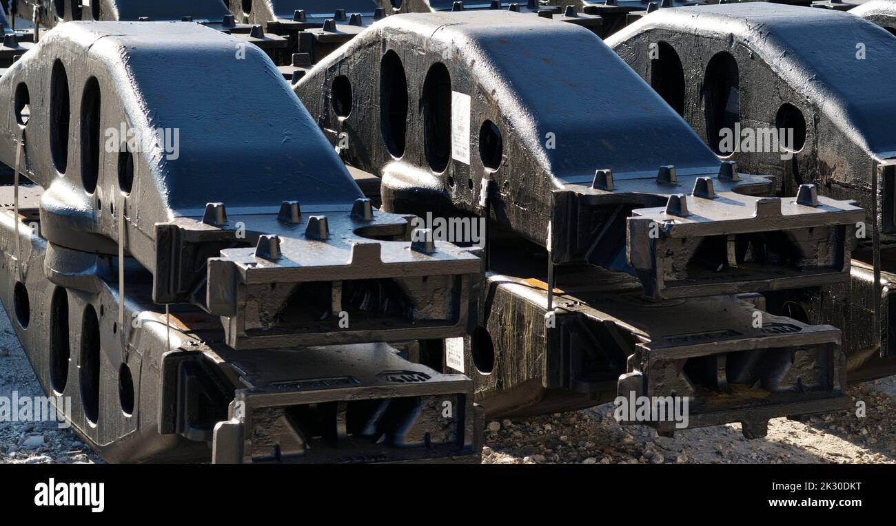 Houston, Texas USA 09-18-2022: Rows of bogie bolsters in a warehouse yard. Heavy duty components used in train wheel carriage assembly. Stock Photo