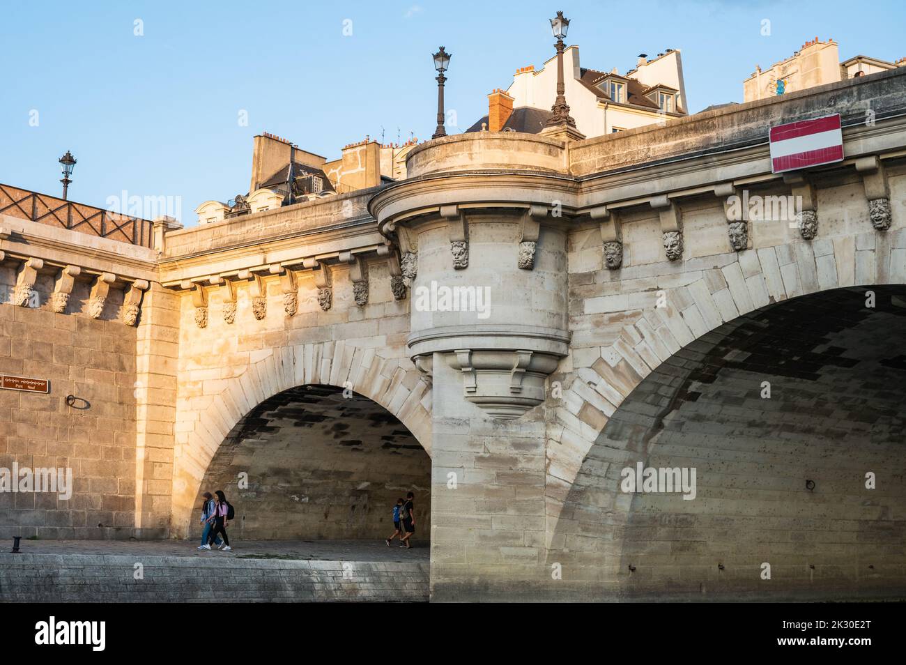 Paris, France - August 26 2022: Pont Neuf, the oldest standing bridge across river Seine in Paris, France with grotesk heads representing forest and field divinities from ancient mythology. Stock Photo