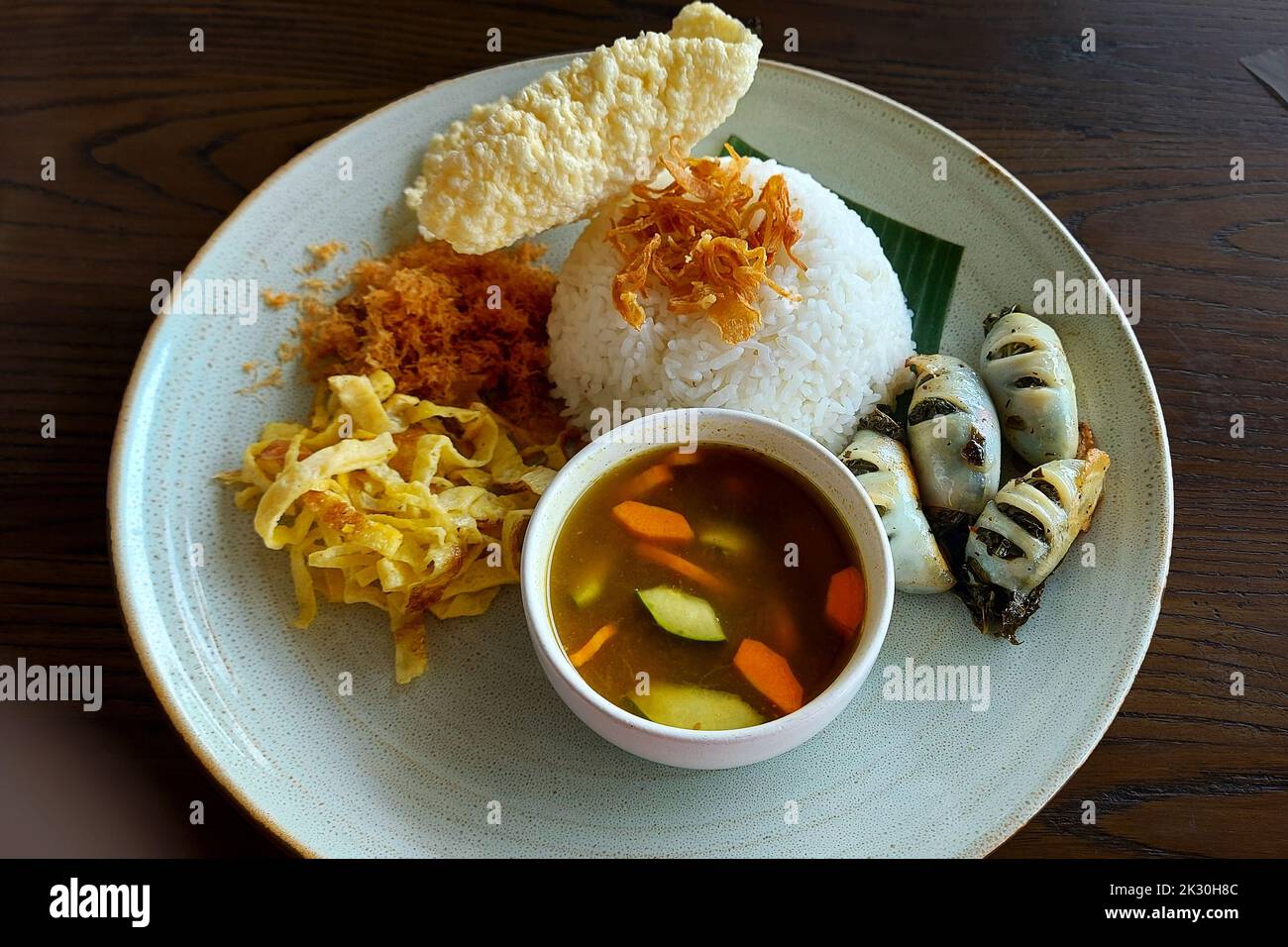 Grilled Papaya Squid with Rice at Cafe Batu, Malang, Indonesia Stock