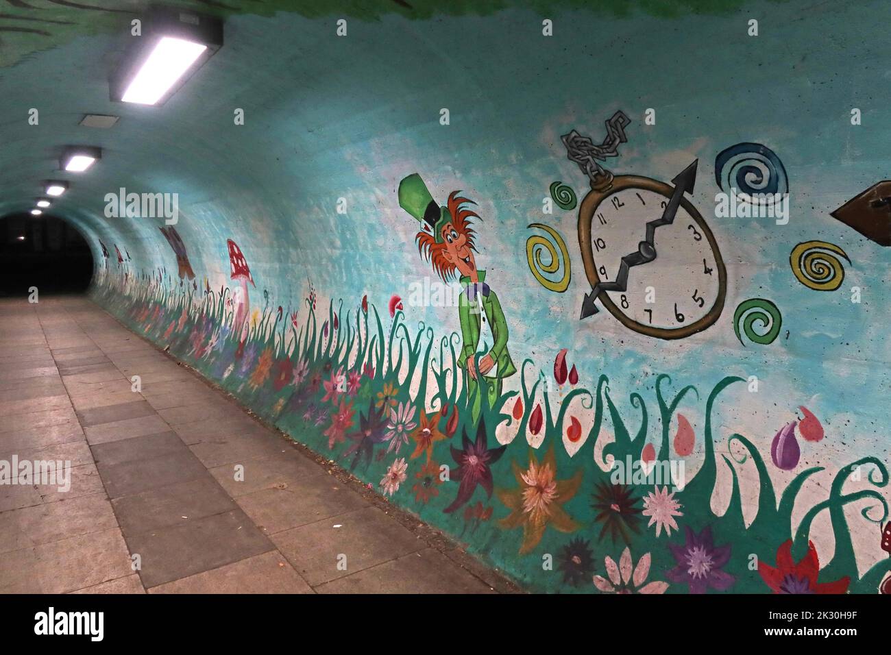 Pedestrian tunnel, with Alice in Wonderland art, Pedestrian tunnel Knutsford road, Latchford, Warrington, Cheshire, England, UK, WA4 1LT Stock Photo