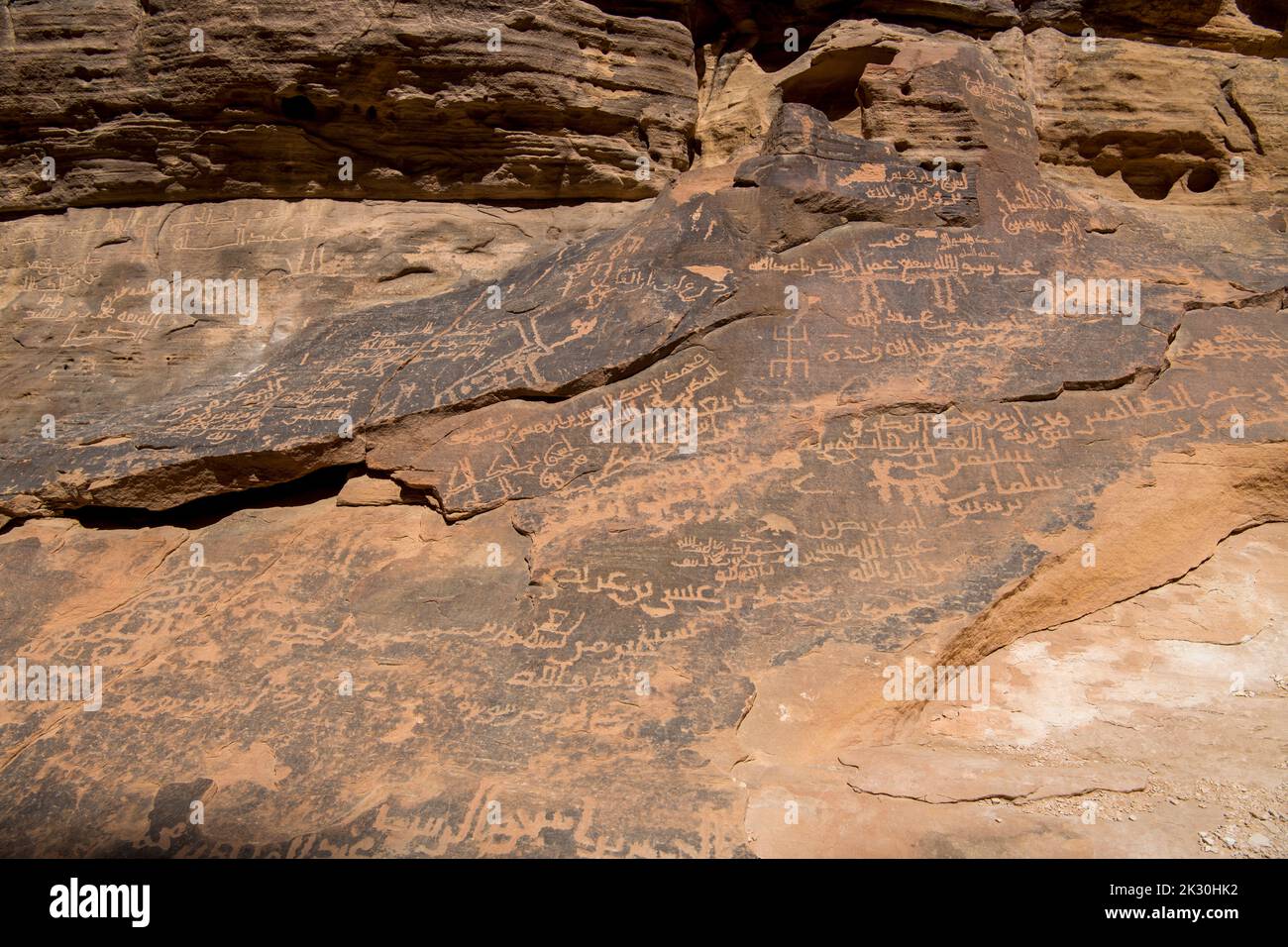 Nabataean script on rockface slot canyon near Al Ula Saudi Arabia Stock Photo