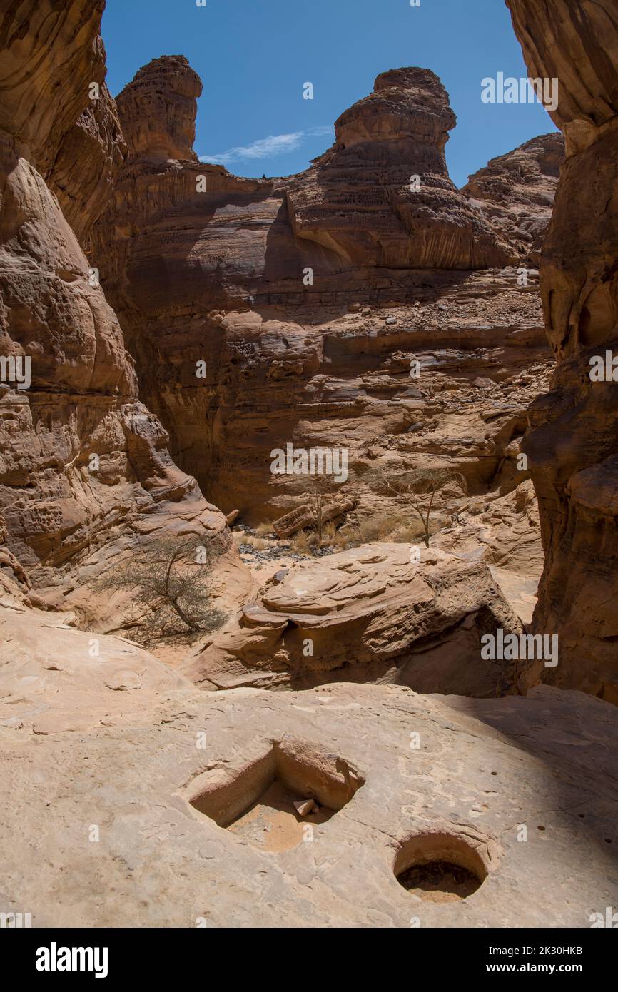 Canyon with strange possibly prehistoric wells near Al Ula Saudi Arabia Stock Photo