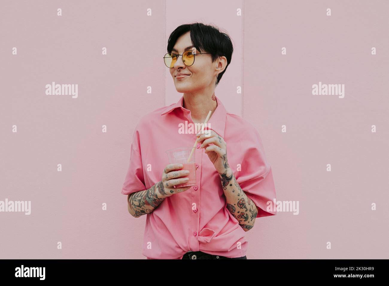 Woman wearing pink shirt glasses hi-res stock photography and images ...