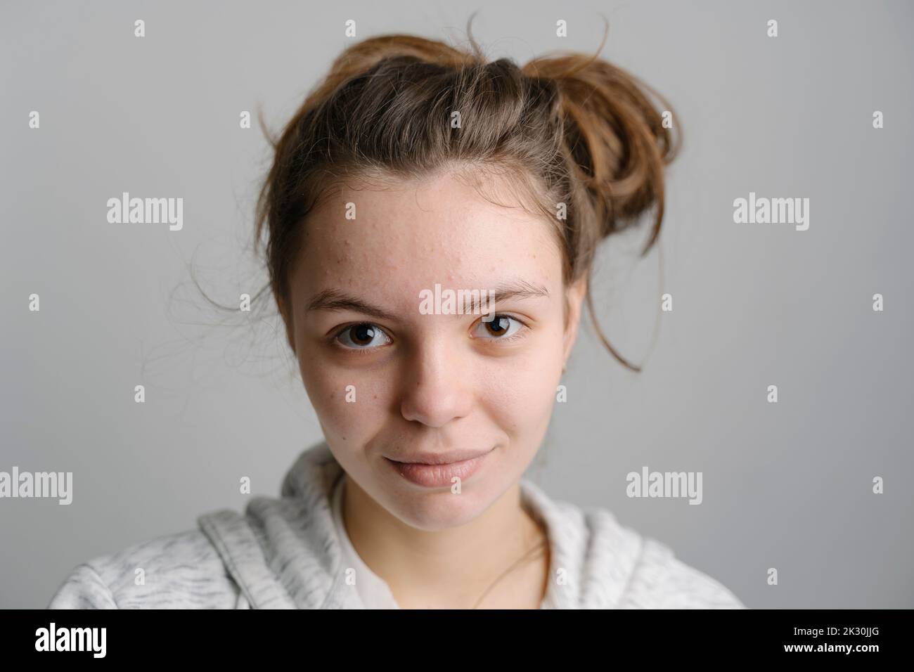 Young woman with messy bun Stock Photo