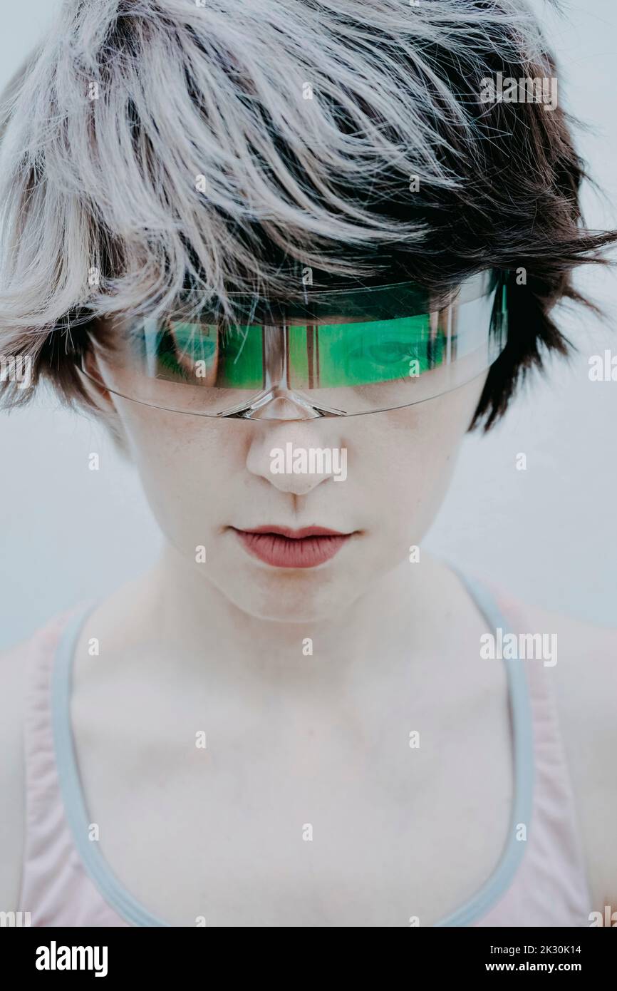 Androgynous woman wearing futuristic glasses Stock Photo