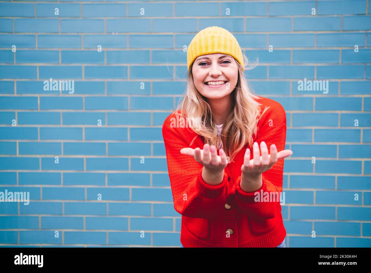 Young woman woolly hat smile hi-res stock photography and images - Alamy
