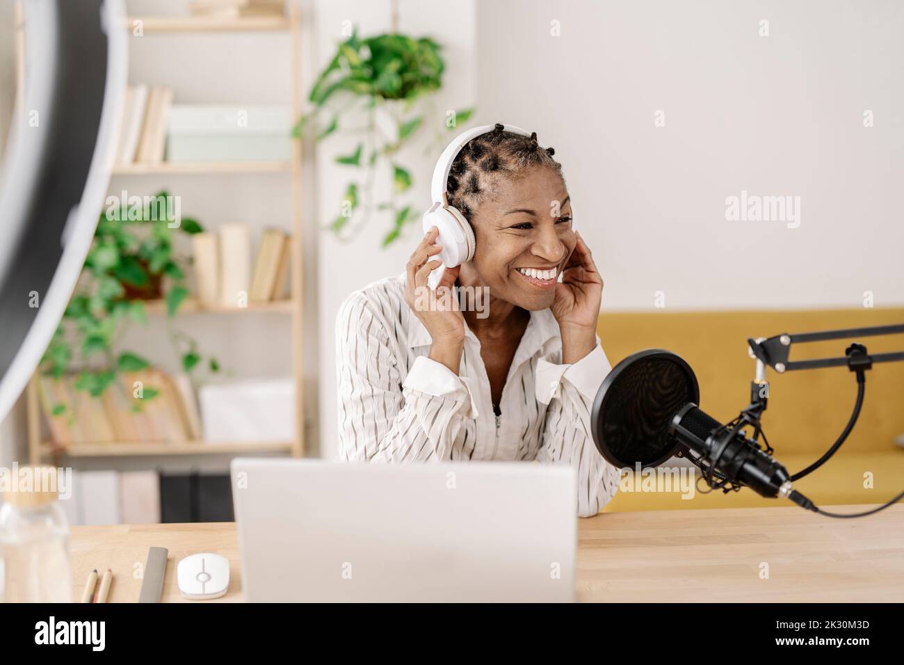 Happy freelancer wearing wireless hi-res stock photography and images ...