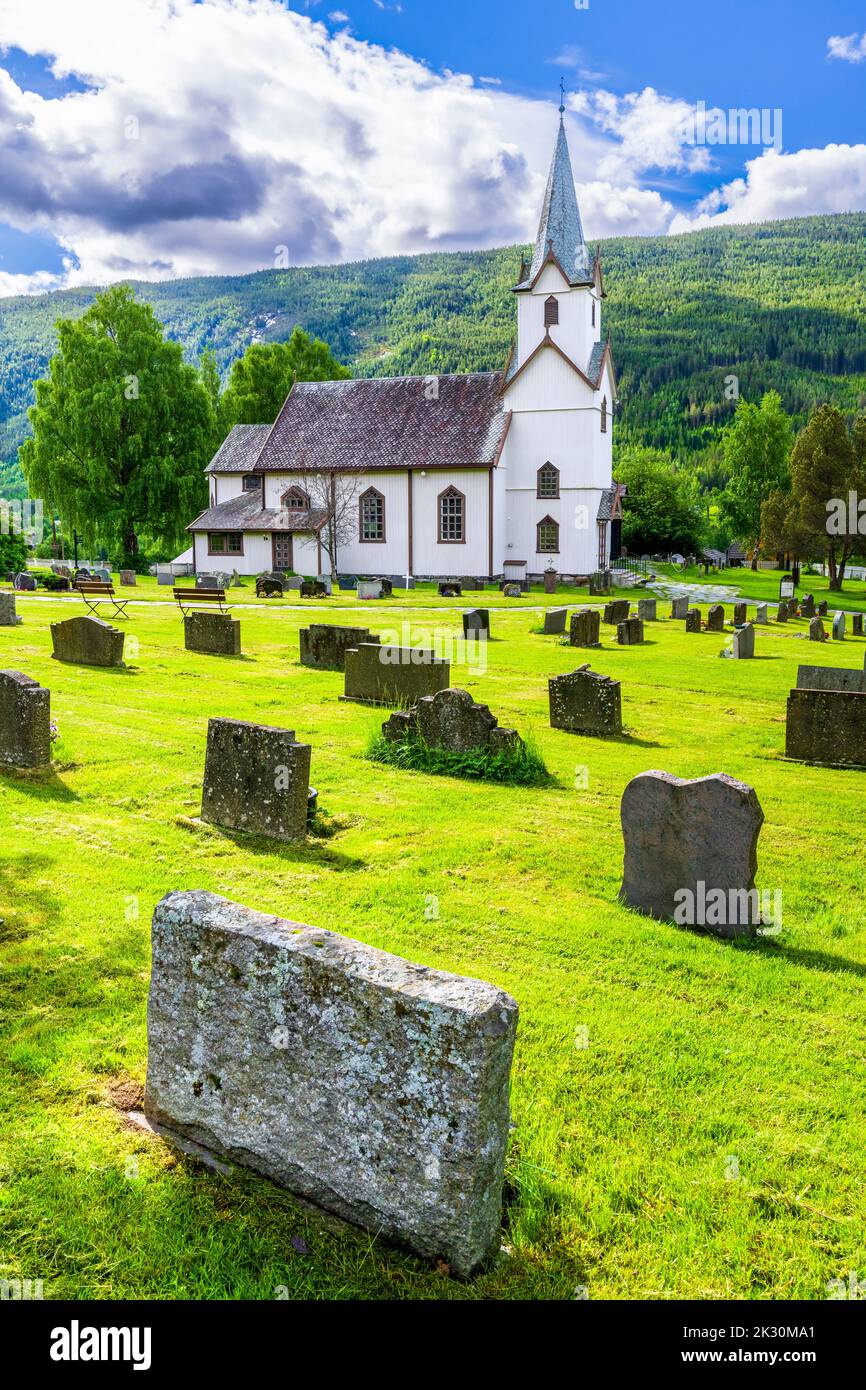 Norway, Viken, Torpo, Cemetery tombstones with rural church in background Stock Photo