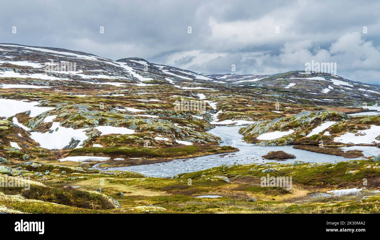 Norway, Viken, River flowing through Hardangervidda plateau Stock Photo