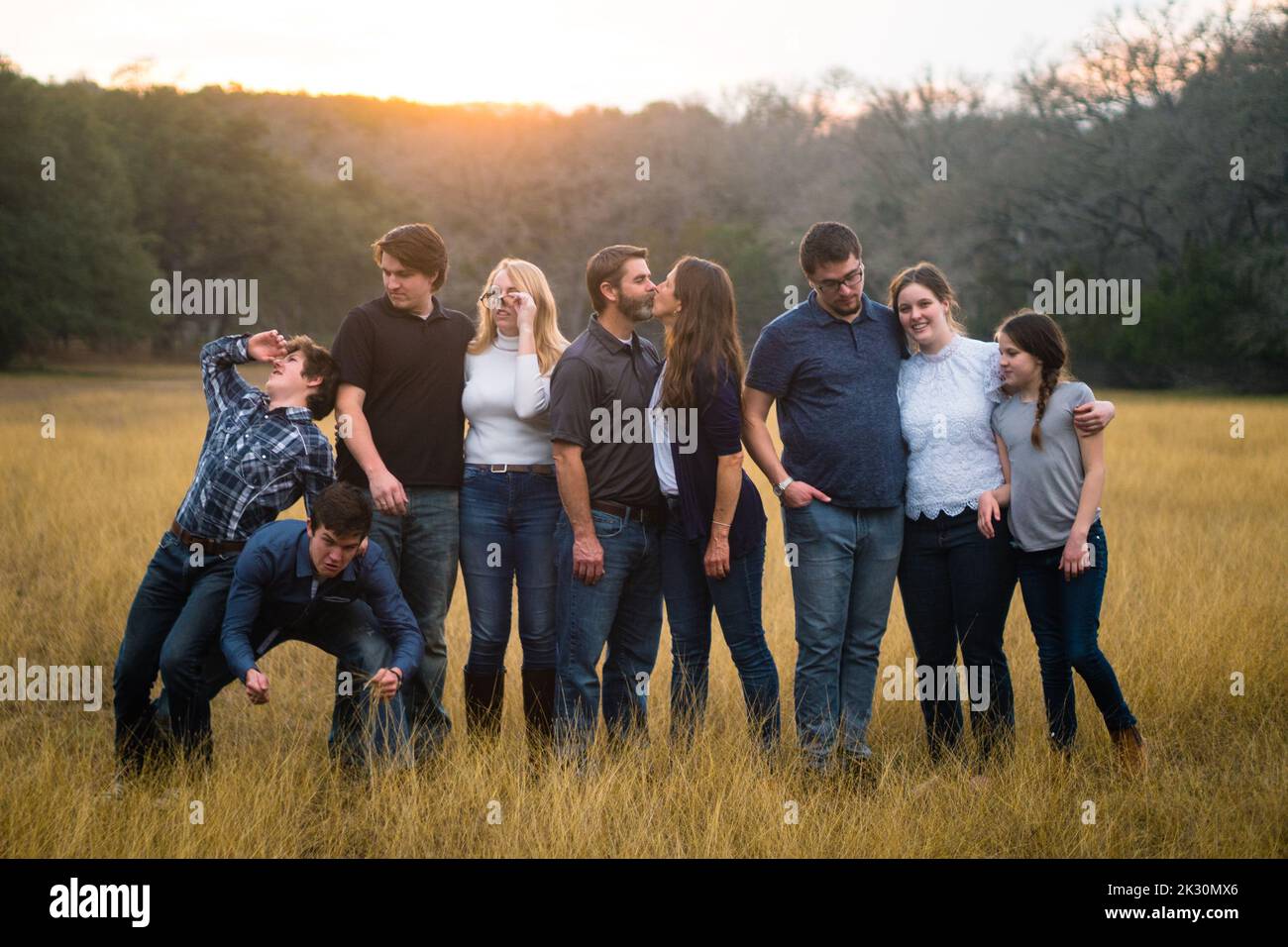 Full length body size photo of charming beautiful funny funky family  rejoicing with their victory over someone wearing white t-shirts jeans  denim while isolated with blue background Stock Photo by ©deagreez1  308496994