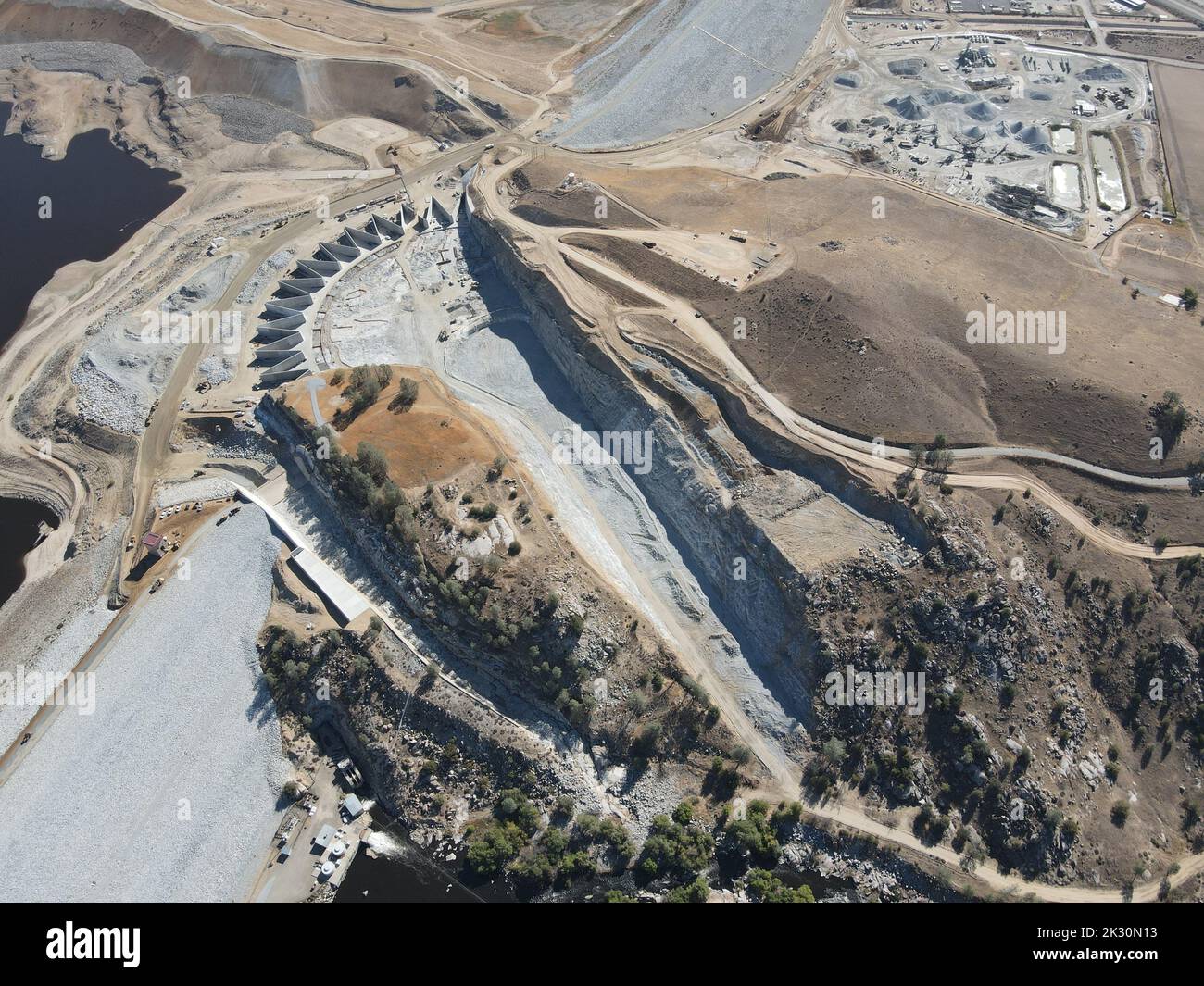 An aerial view of the labyrinth weir, emergency spillway, and service