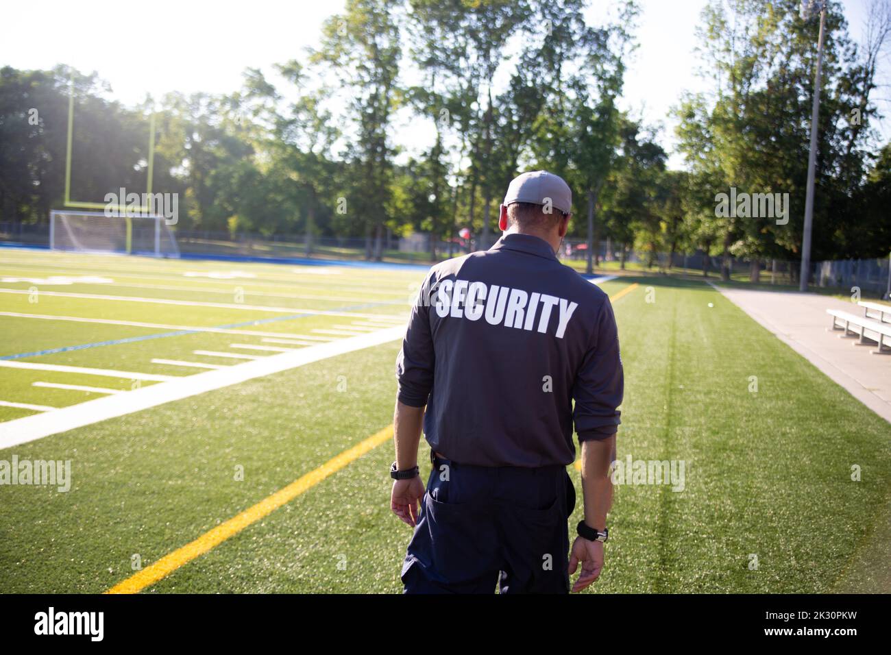 Security guard patrolling soccer stadium Stock Photo Alamy