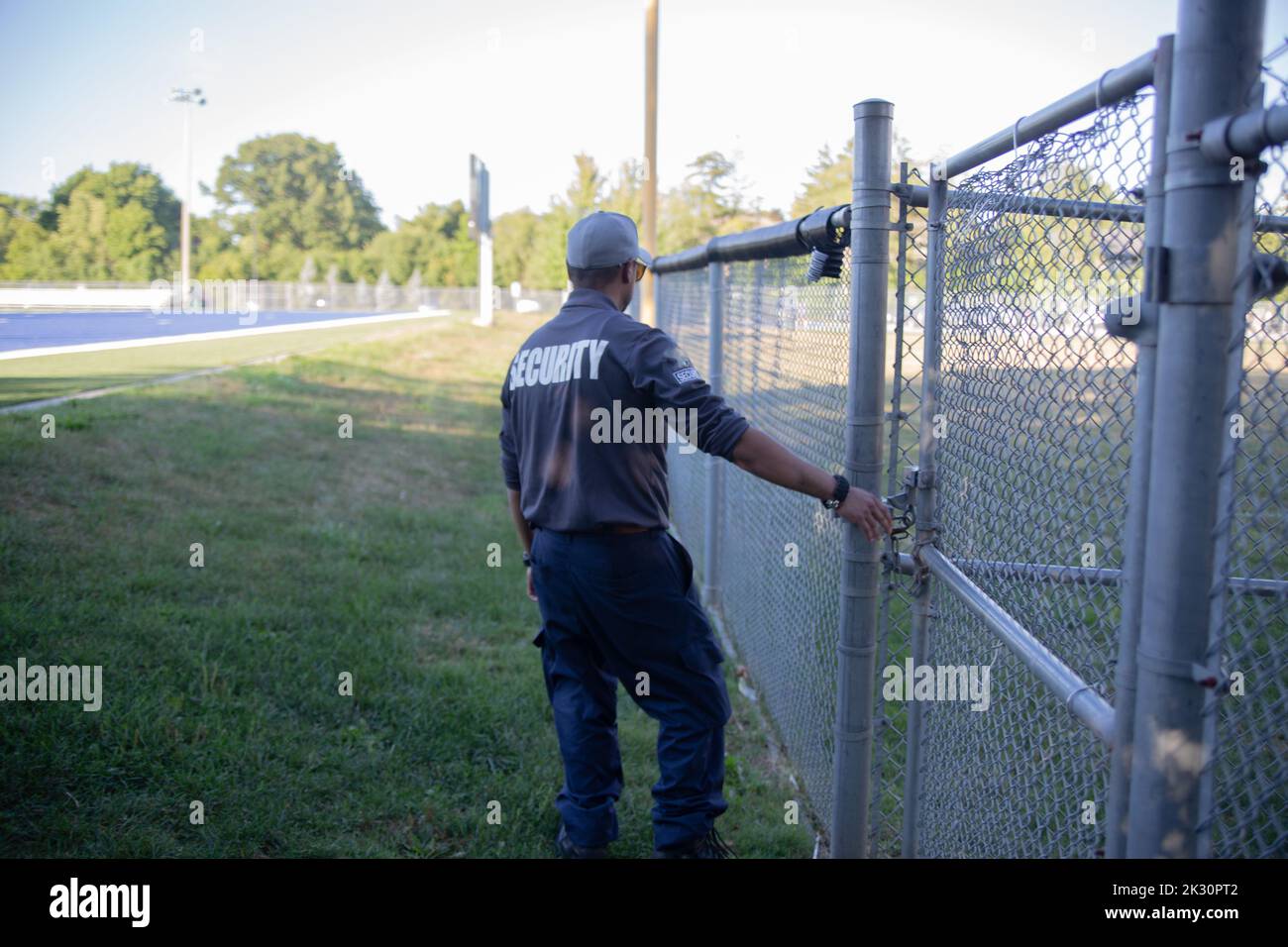 Security guard patrolling soccer stadium Stock Photo Alamy