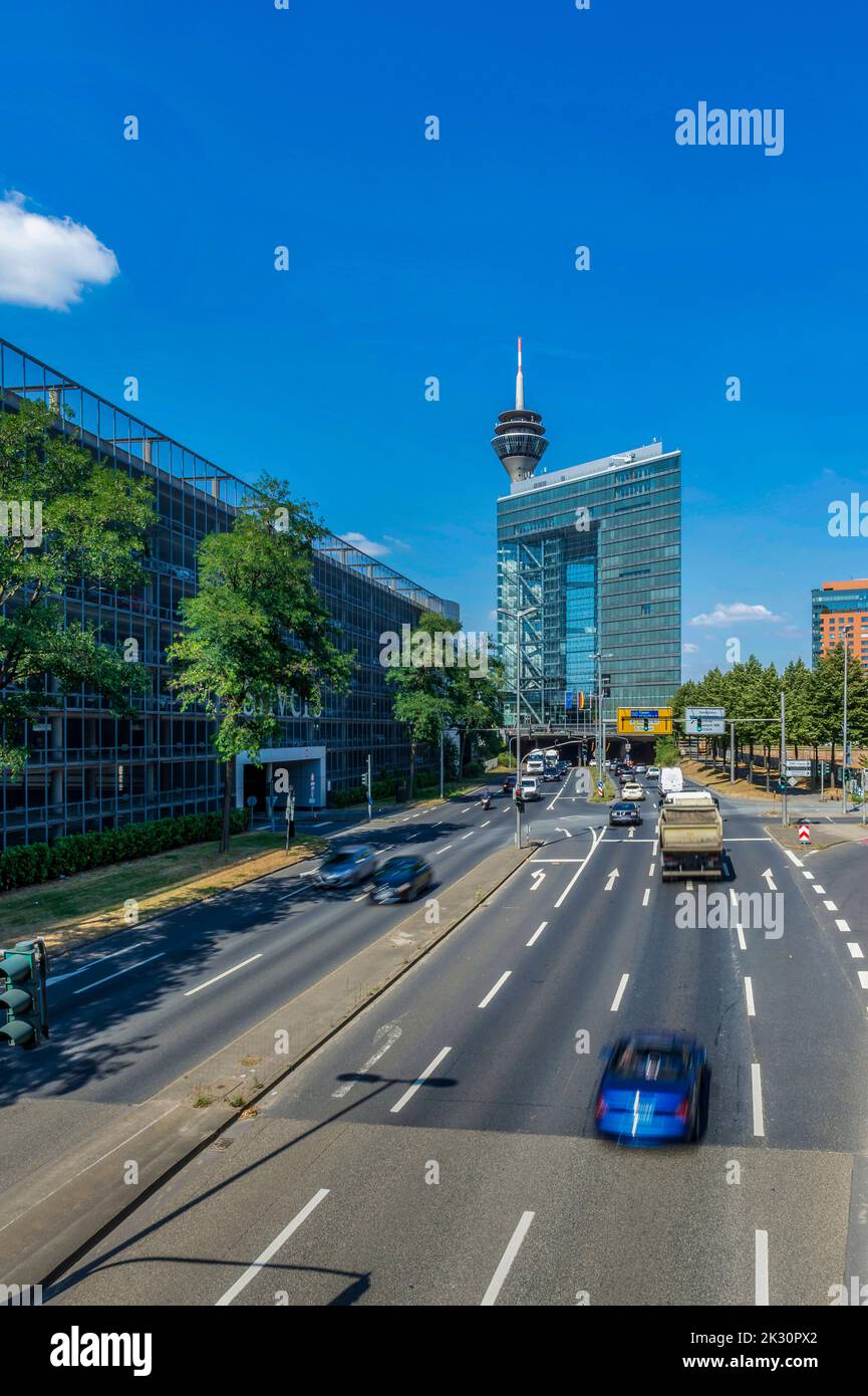 Germany, North Rhine-Westphalia, Dusseldorf, Traffic along Volklinger Strasse with Stadttor in background Stock Photo