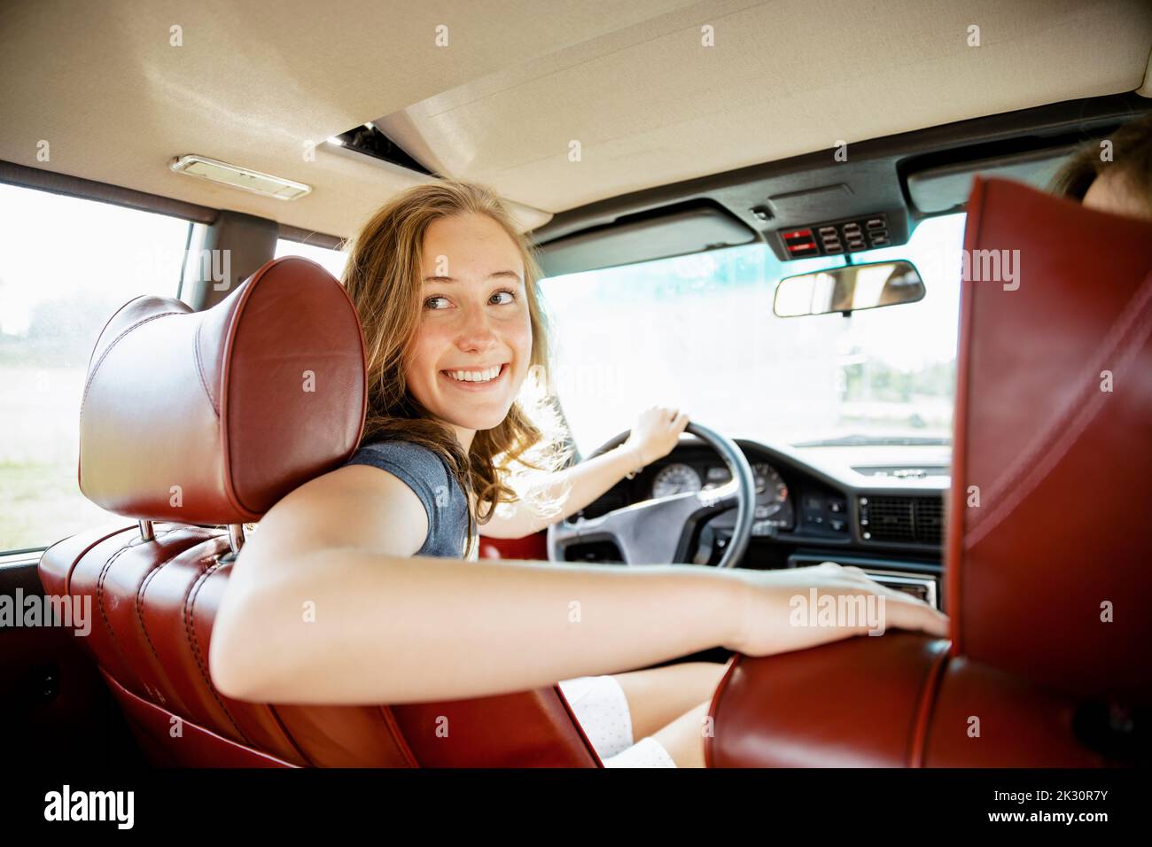 Girl driving classic car hires stock photography and images Alamy