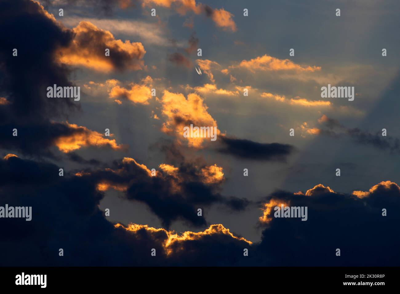 Clouds illuminated by setting sun Stock Photo