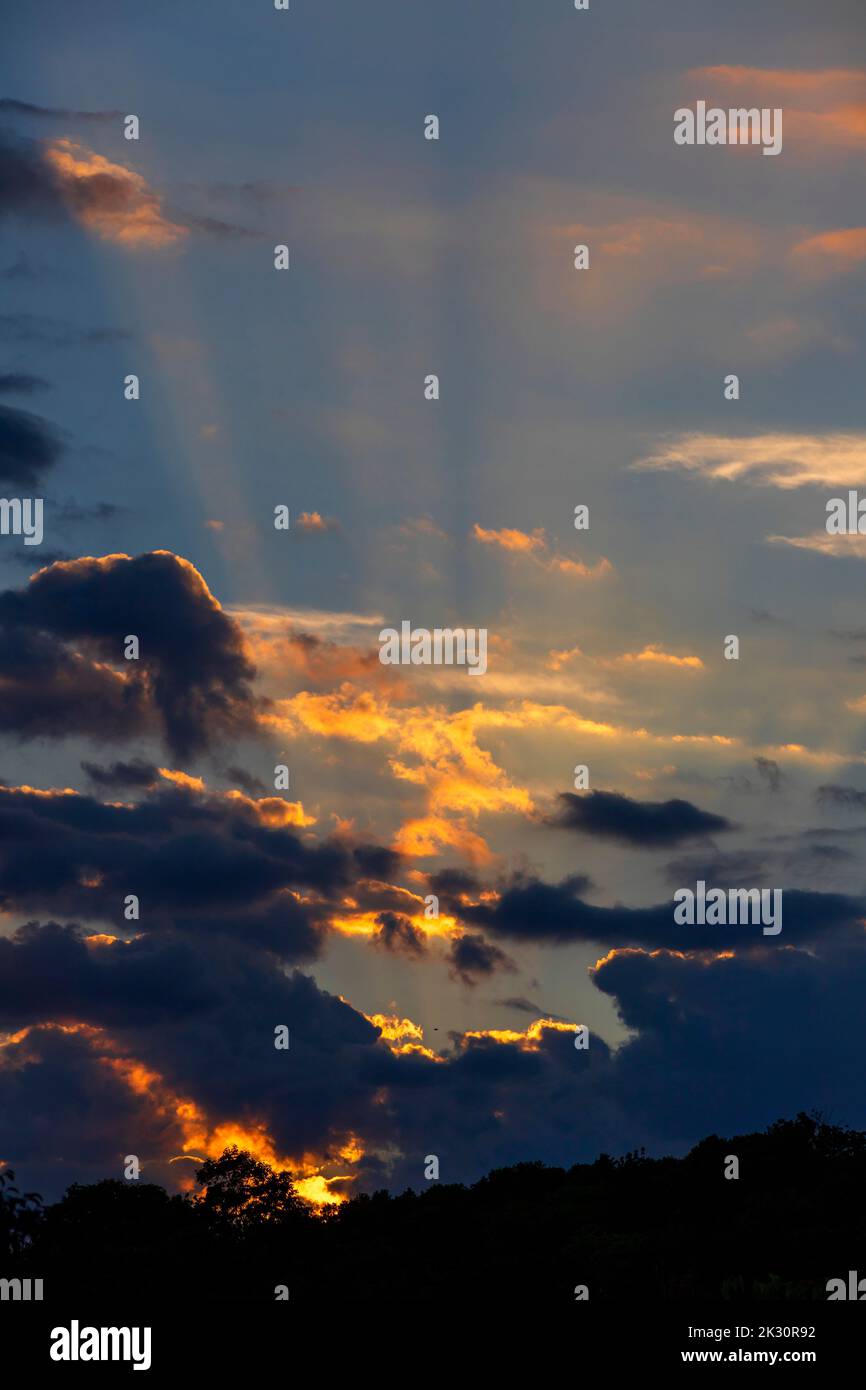 Clouds illuminated by setting sun Stock Photo
