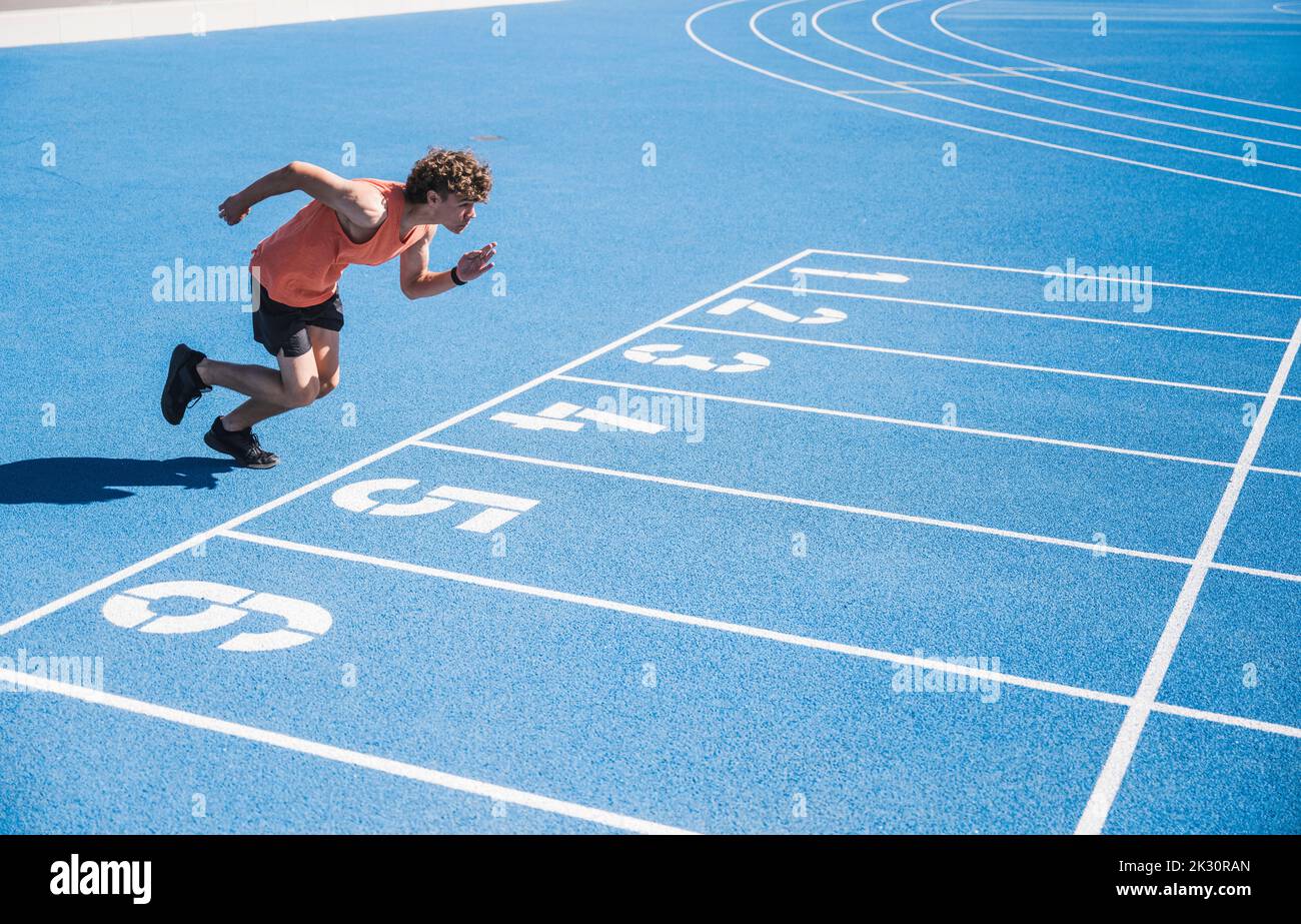 Young athlete running on track Stock Photo Alamy