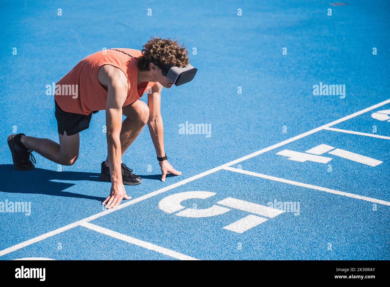 Kneeling young man wearing hi-res stock photography and images - Alamy