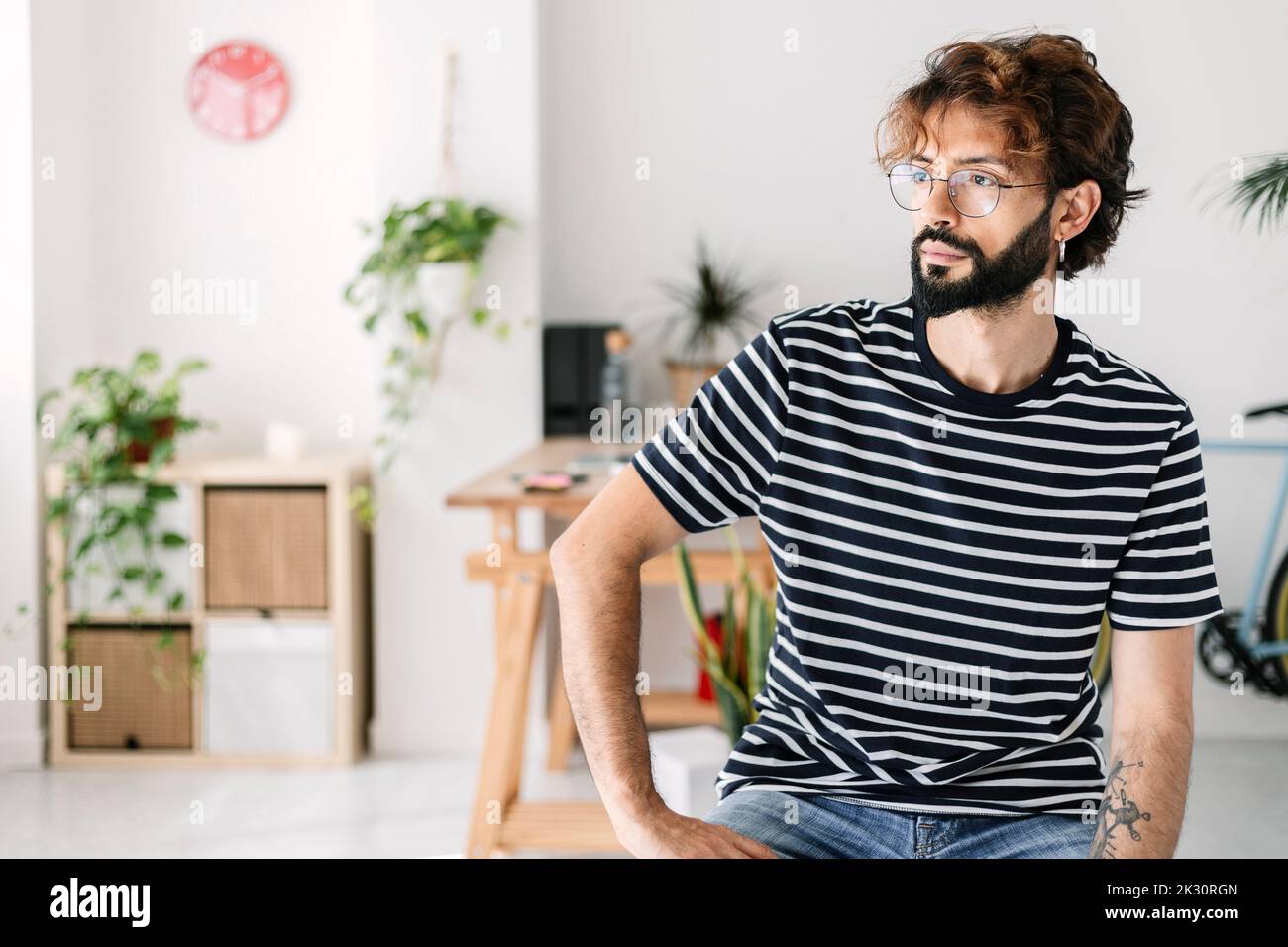 Thoughtful man sitting in hi-res stock photography and images - Alamy
