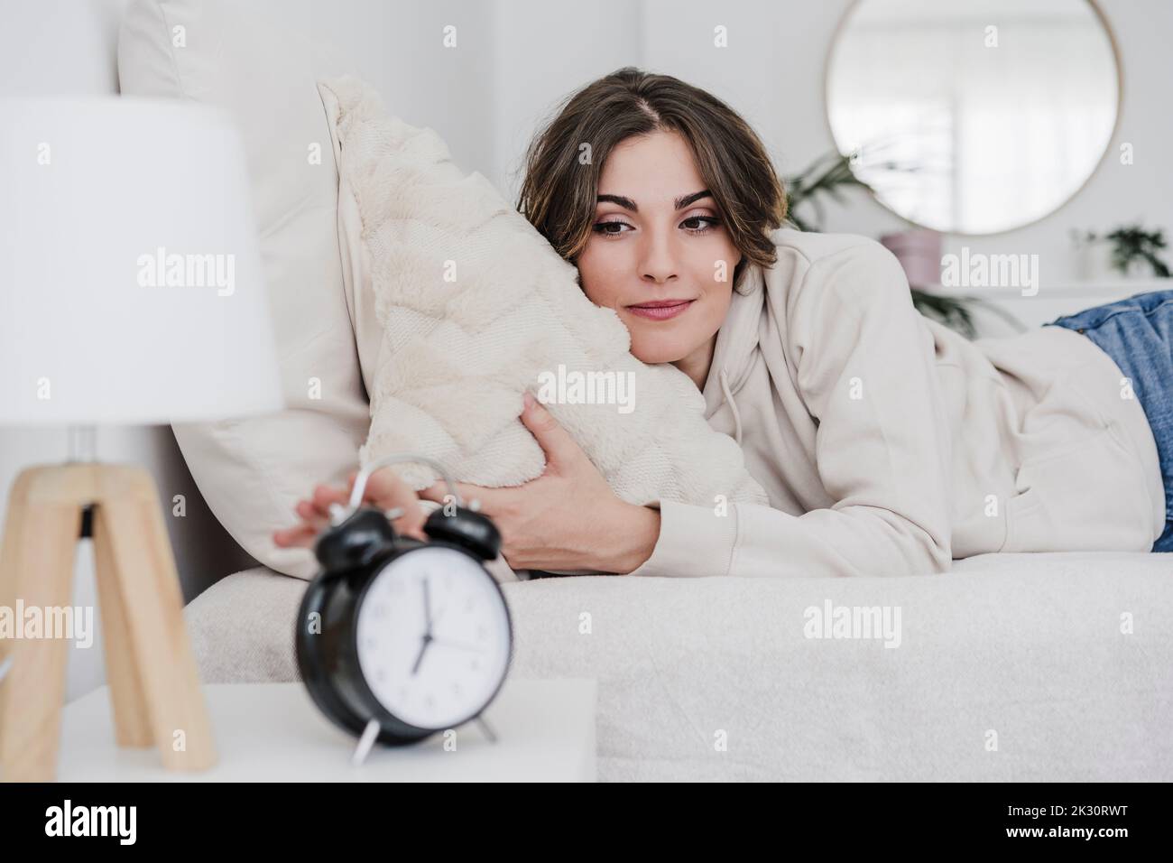 Beautiful woman lying in bed hi-res stock photography and images - Alamy