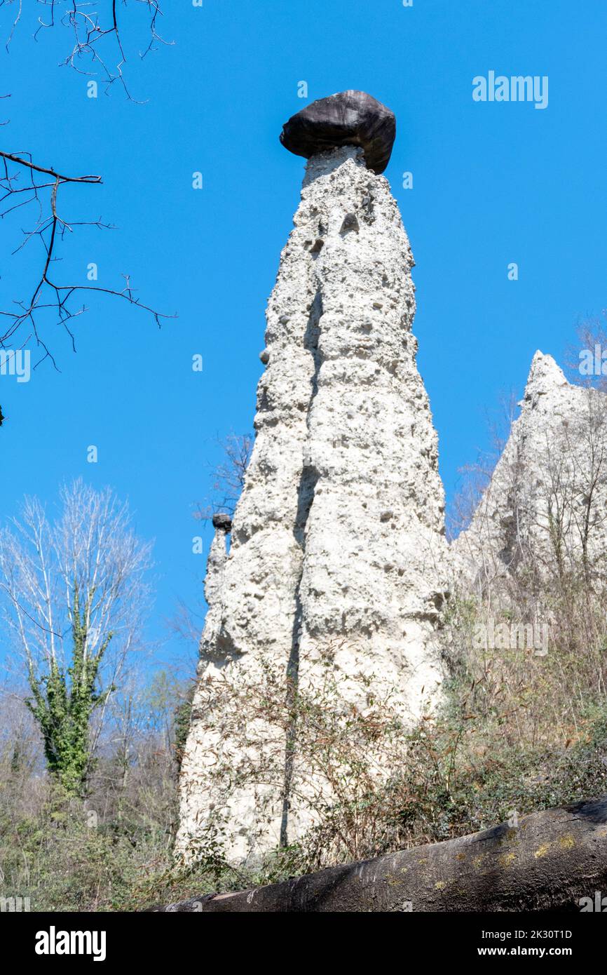 Rock formations, also known as fairy chimneys, earth pyramids, hoodoos ( italian: Piramidi di Zone ) - Zone, Italy Stock Photo