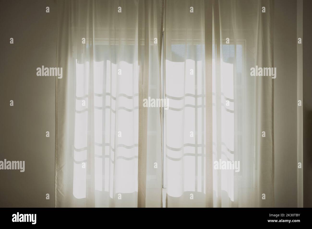 White color curtains on window at home Stock Photo