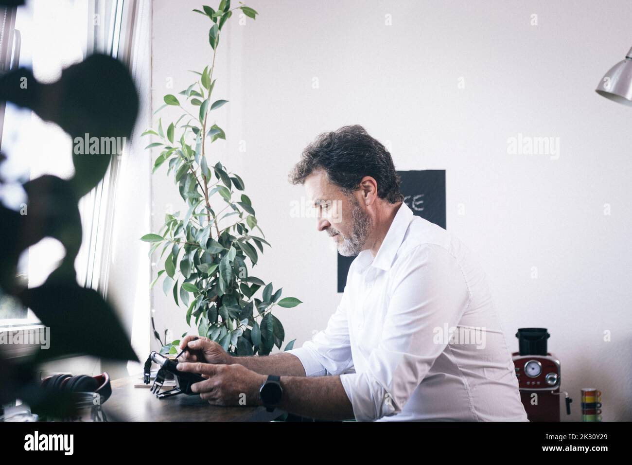 Businessman working on tablet PC at office Stock Photo