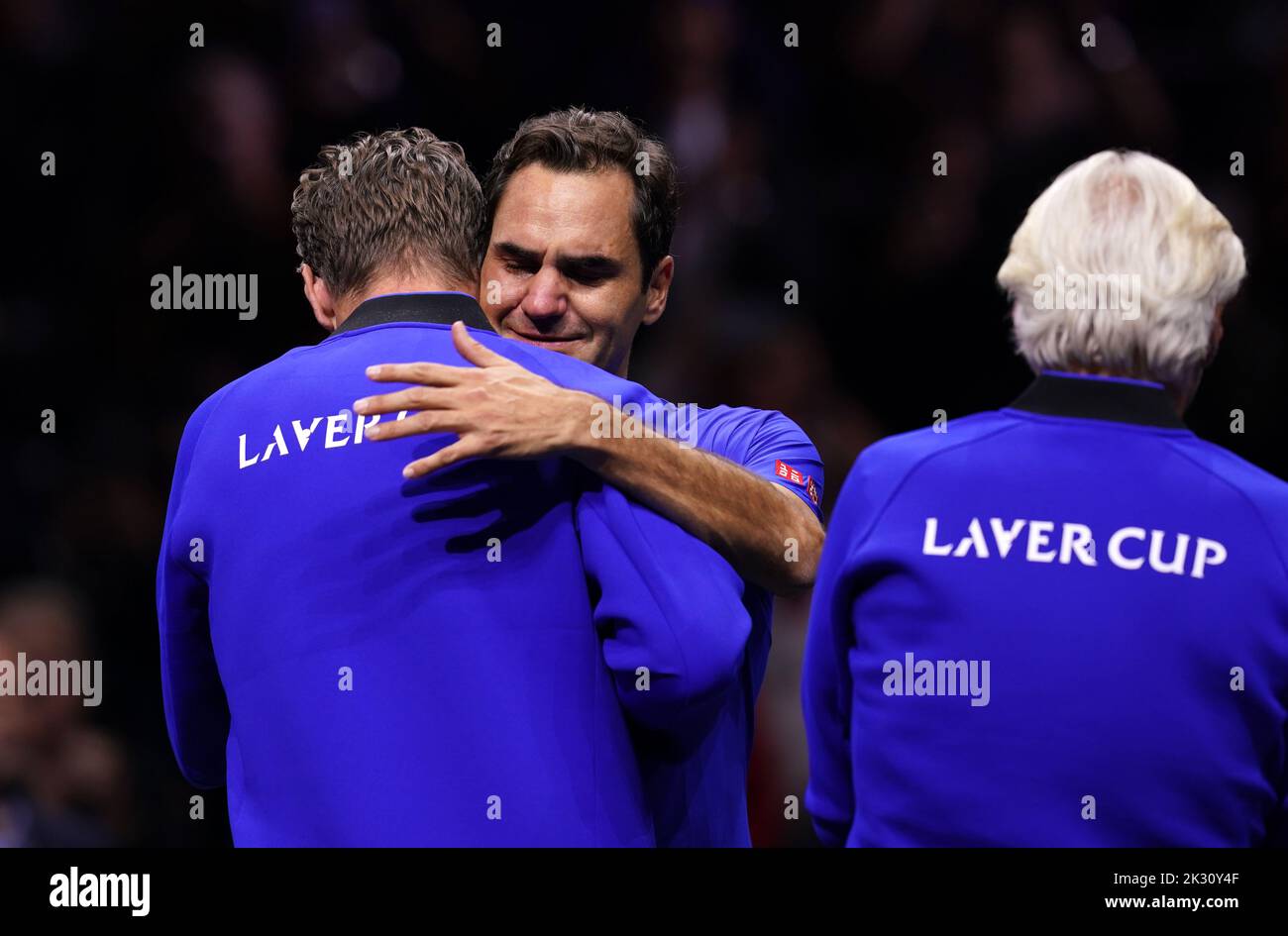 Roger Federer is embraced by his team-mates after his final competitive match on day one of the Laver Cup at the O2 Arena, London. Picture date: Friday September 23, 2022. Stock Photo