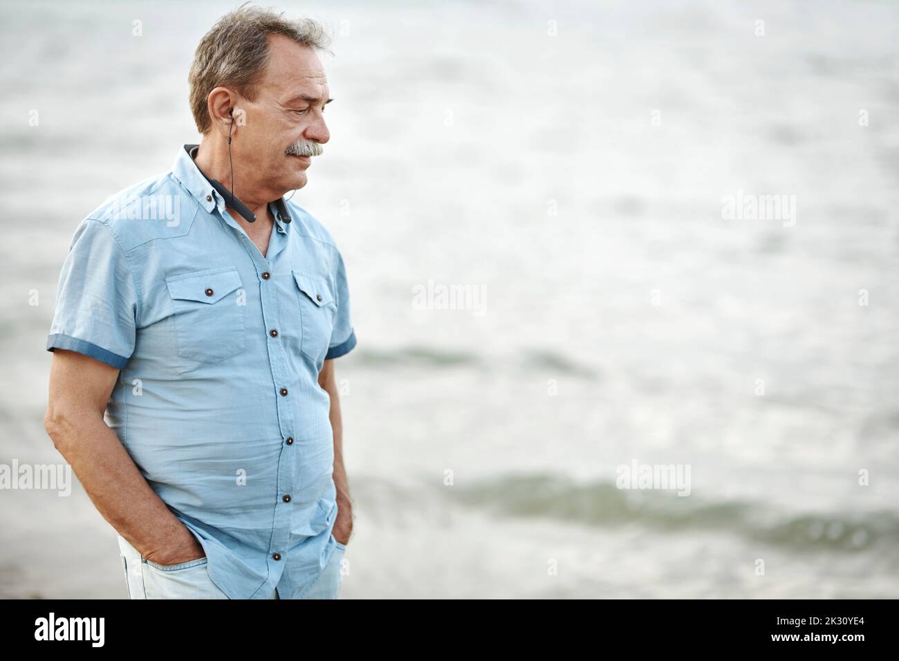 Senior man walking in water hi-res stock photography and images - Alamy