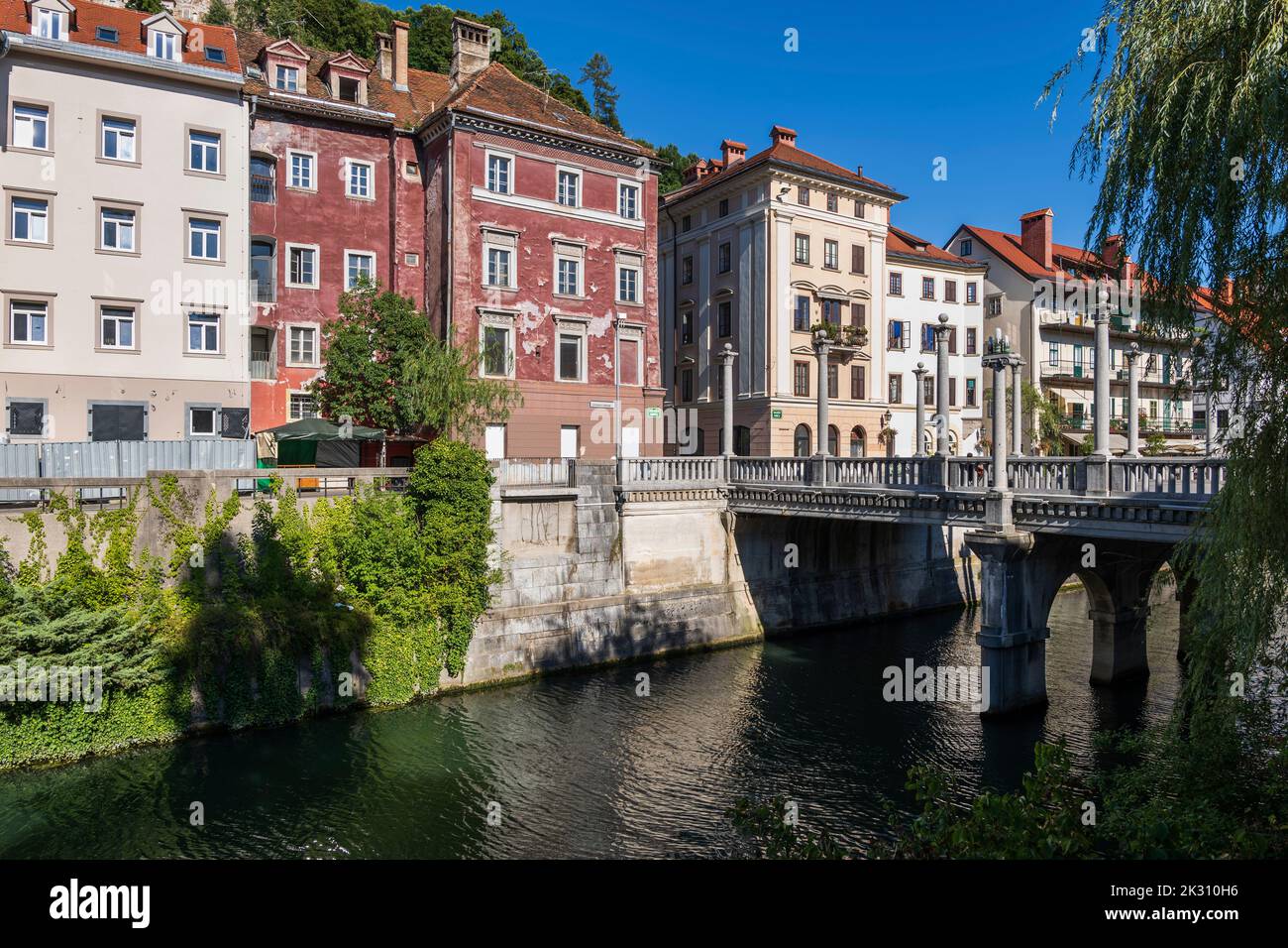 Slovenia, Ljubljana, Old town buildings standing along Ljubljanica river Stock Photo