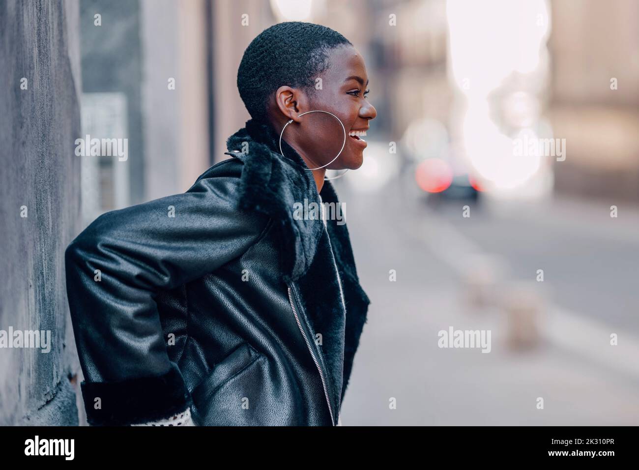 Woman in black leather jacket hi-res stock photography and images - Alamy