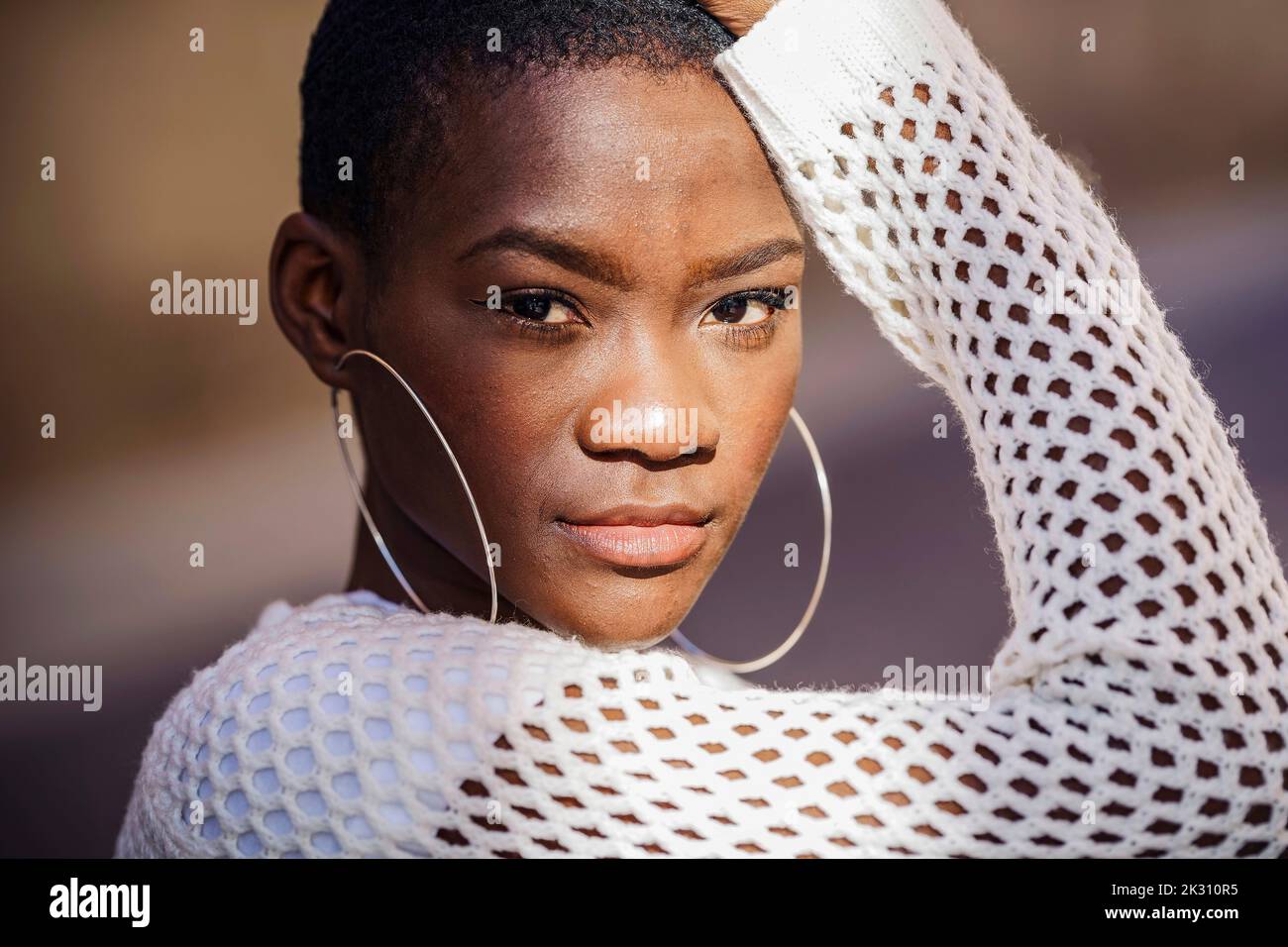 Hoop earrings close up hi-res stock photography and images - Alamy