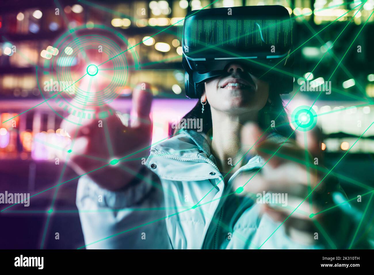 Woman wearing VR glasses experiencing immersive cyberspace Stock Photo