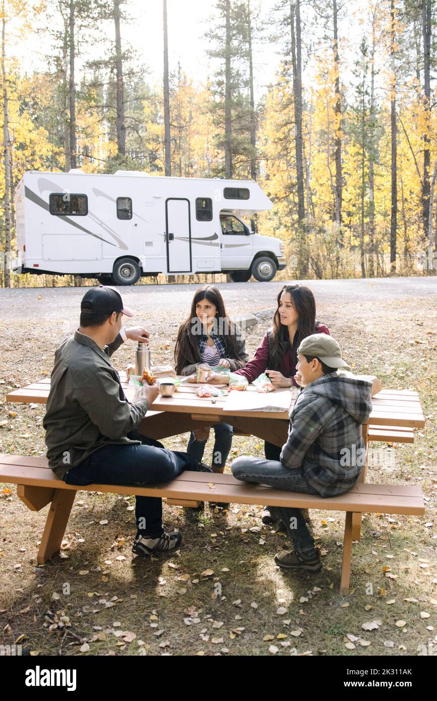 Family sitting at picnic table hires stock photography and images Alamy