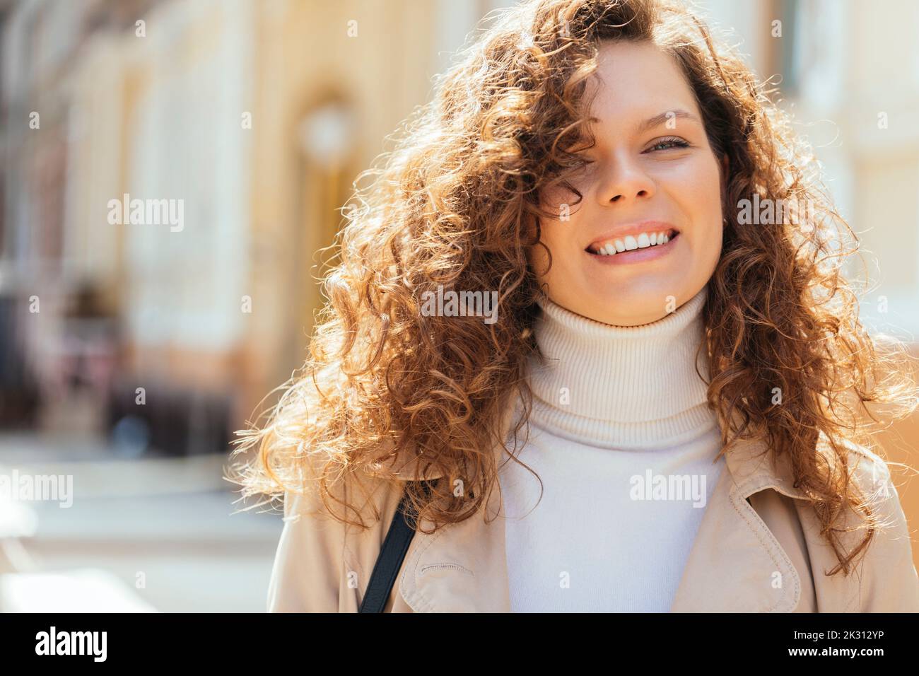 Curly light brown hair hi-res stock photography and images - Alamy