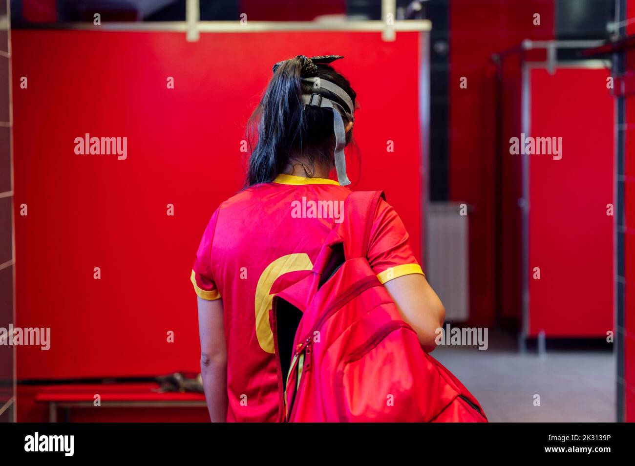 Lacrosse player with backpack in locker room Stock Photo Alamy