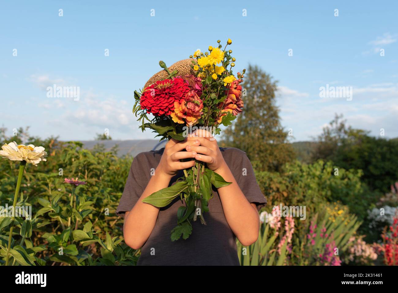 Boy holding flowers hi-res stock photography and images - Alamy