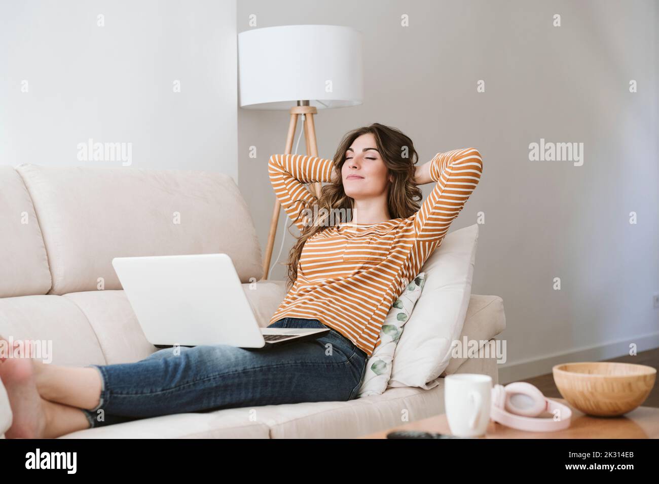 Woman leaning on back sofa hi-res stock photography and images - Alamy