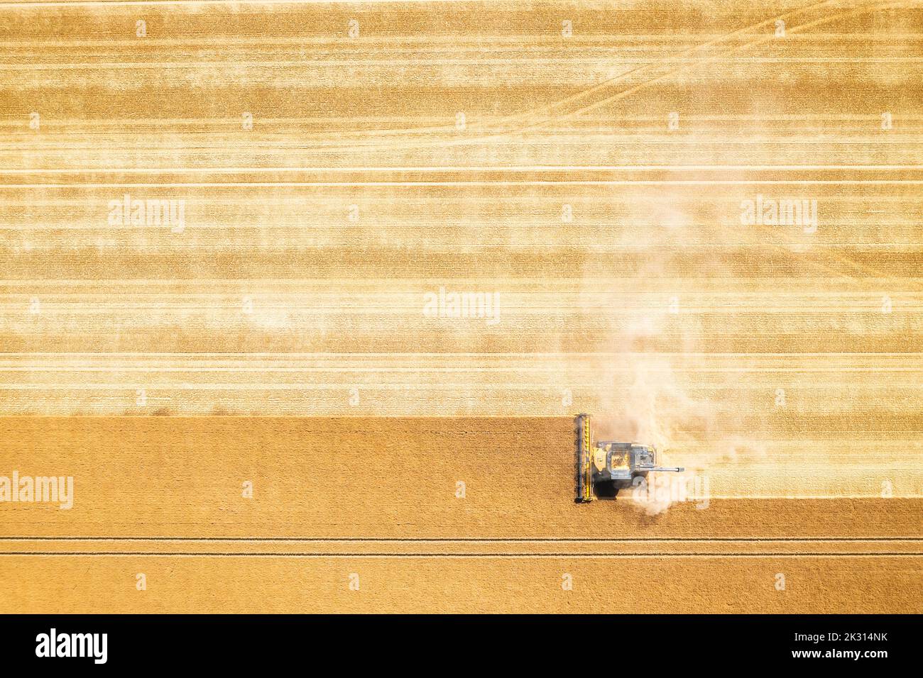 Aerial view of combine harvester in vast wheat field Stock Photo - Alamy
