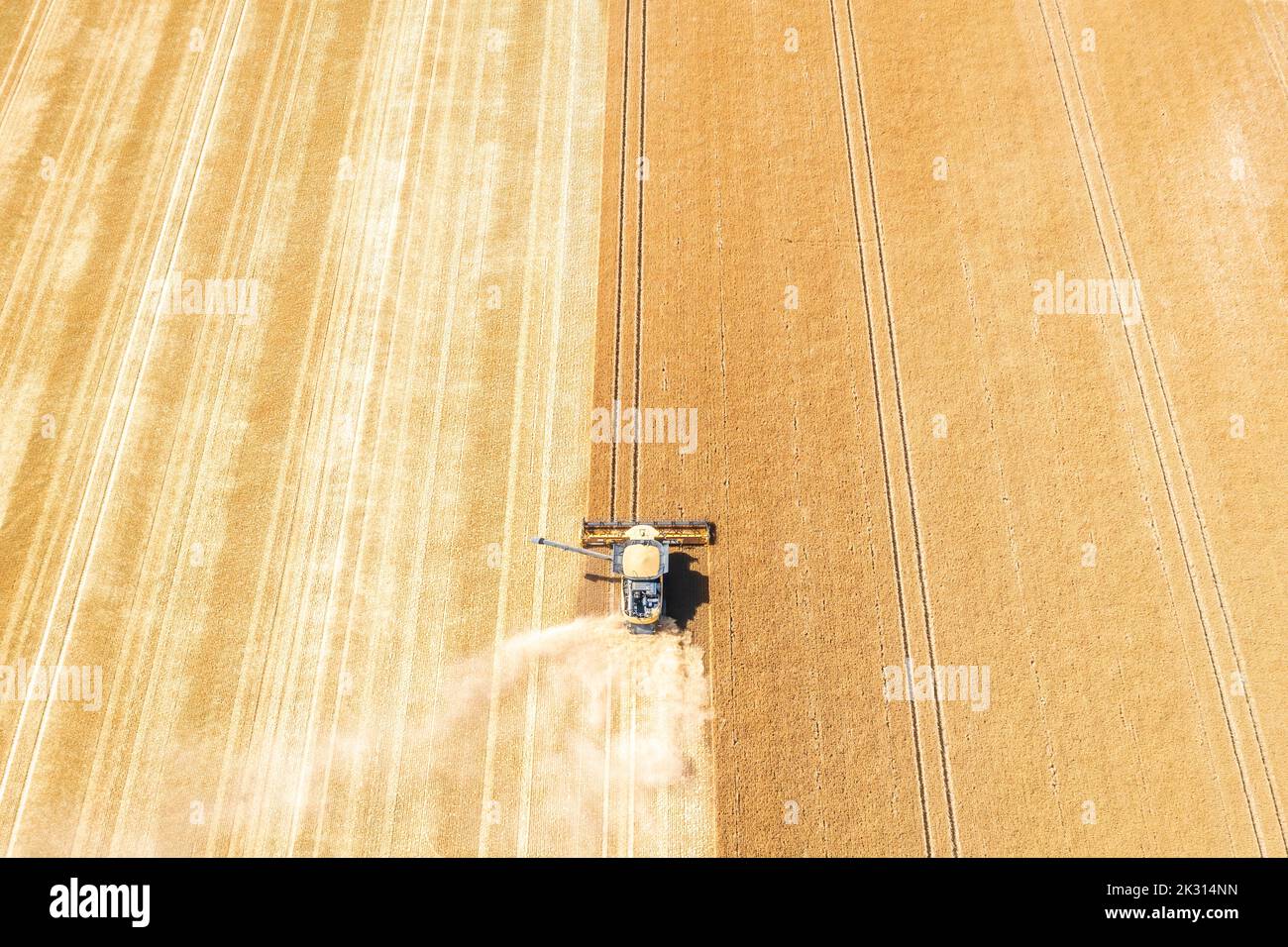 Aerial view of combine harvester in vast wheat field Stock Photo - Alamy