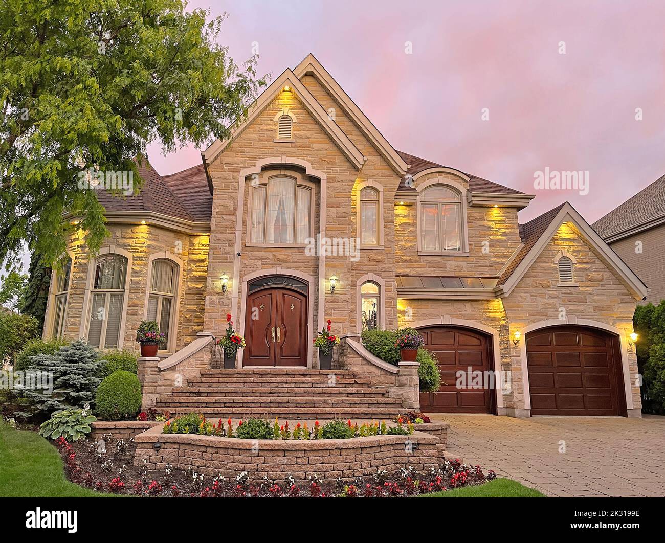 Luxury Home exterior at sunset Stock Photo