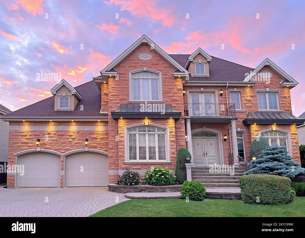 Luxury Home exterior at sunset Stock Photo