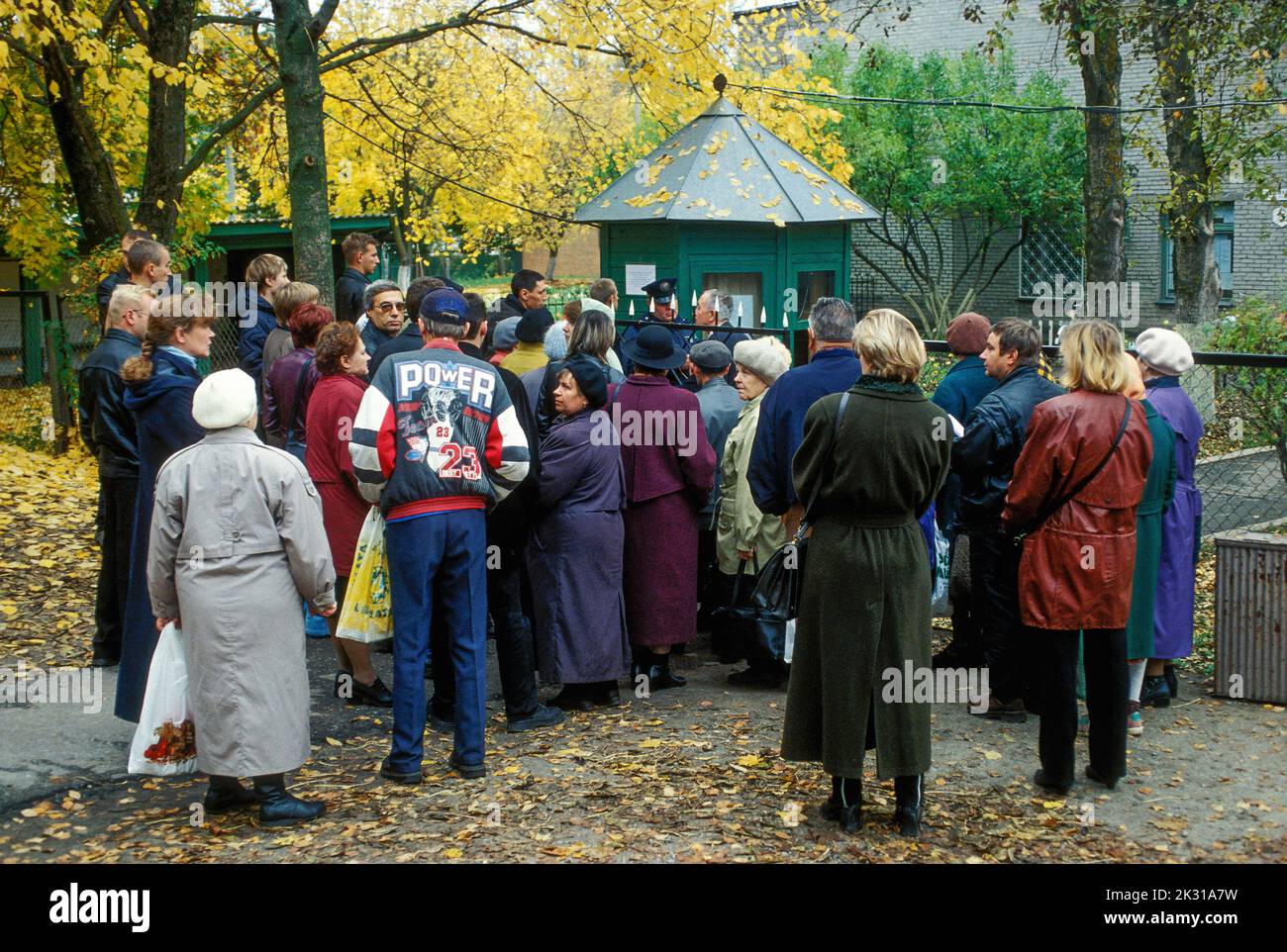 Applicants crowding the gate of the Russian consulate in the Estonian border town of Narva Stock Photo