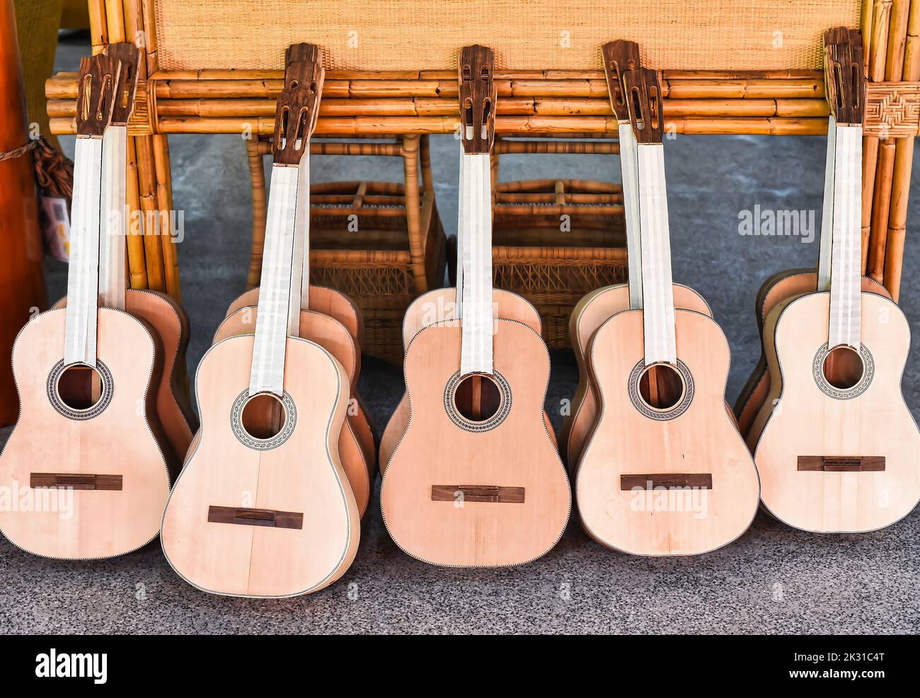 Many unfinished wooden drying guitars in workshop Stock Photo