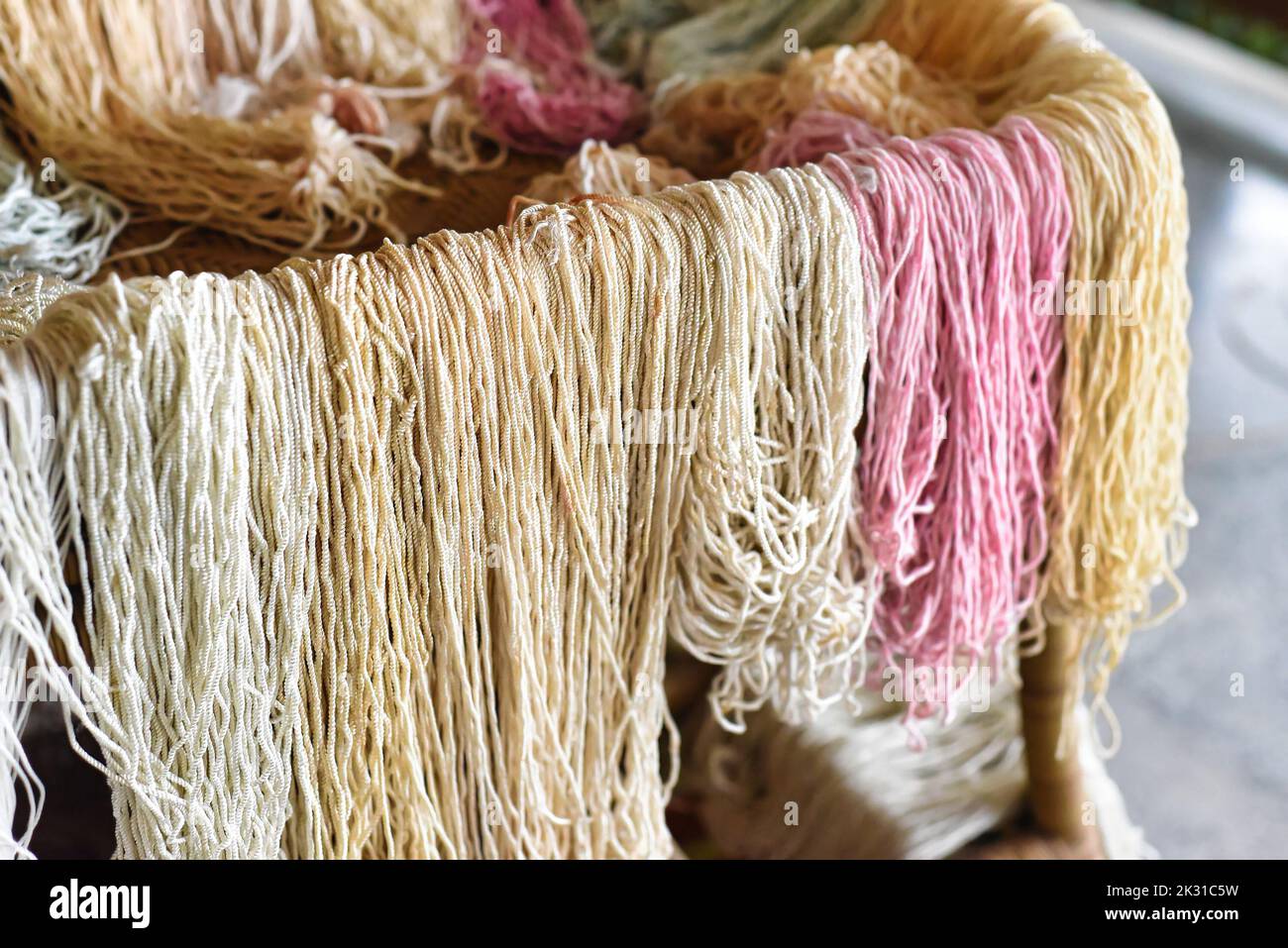 Many colorful prepared threads for weaving hammocks in vietnam Stock Photo