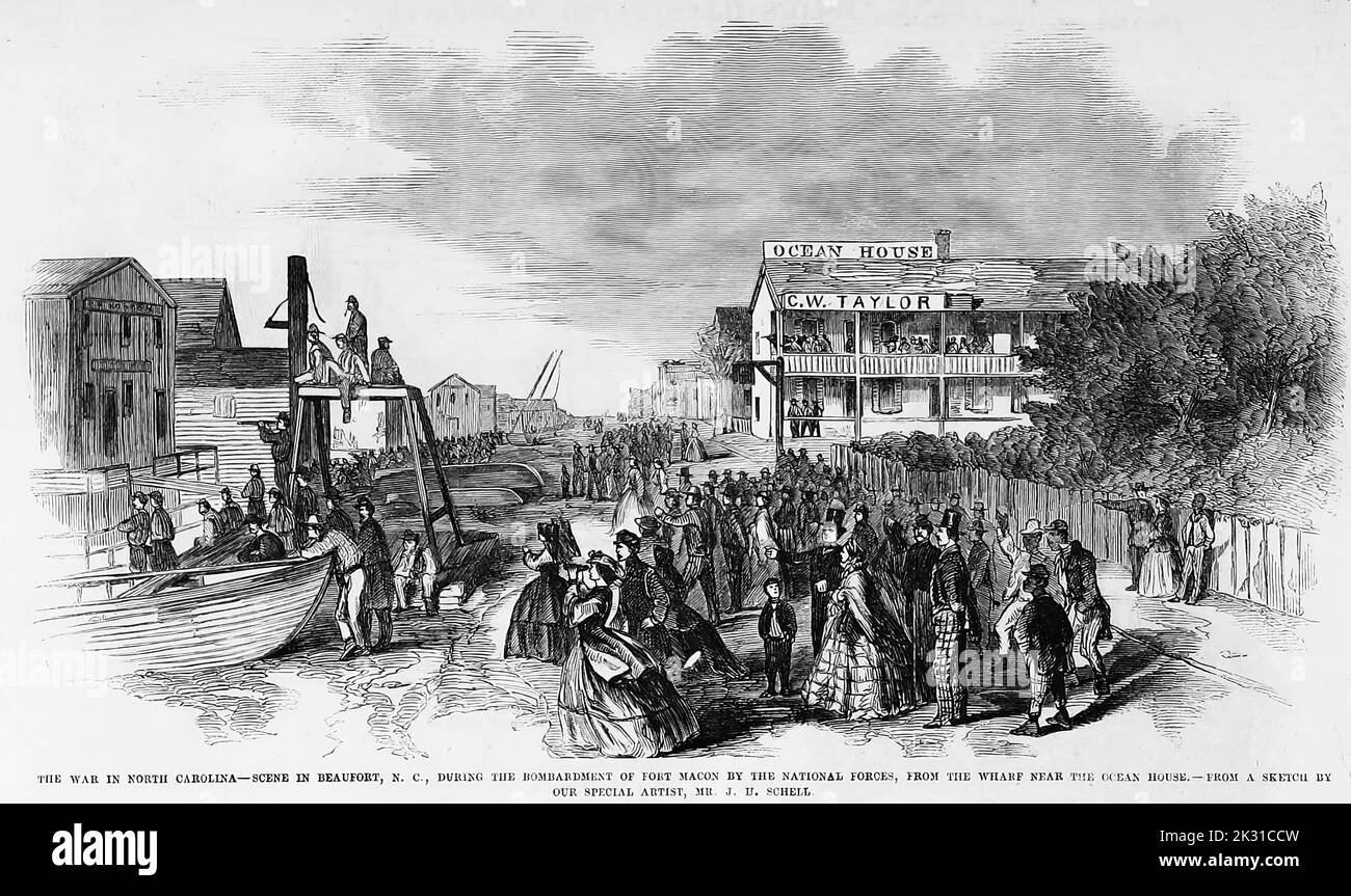 The War in North Carolina - Scene in Beaufort, North Carolina, during the bombardment of Fort Macon by the National forces, from the wharf near the Ocean House. April 1862. Siege of Fort Macon. 19th century American Civil War illustration from Frank Leslie's Illustrated Newspaper Stock Photo