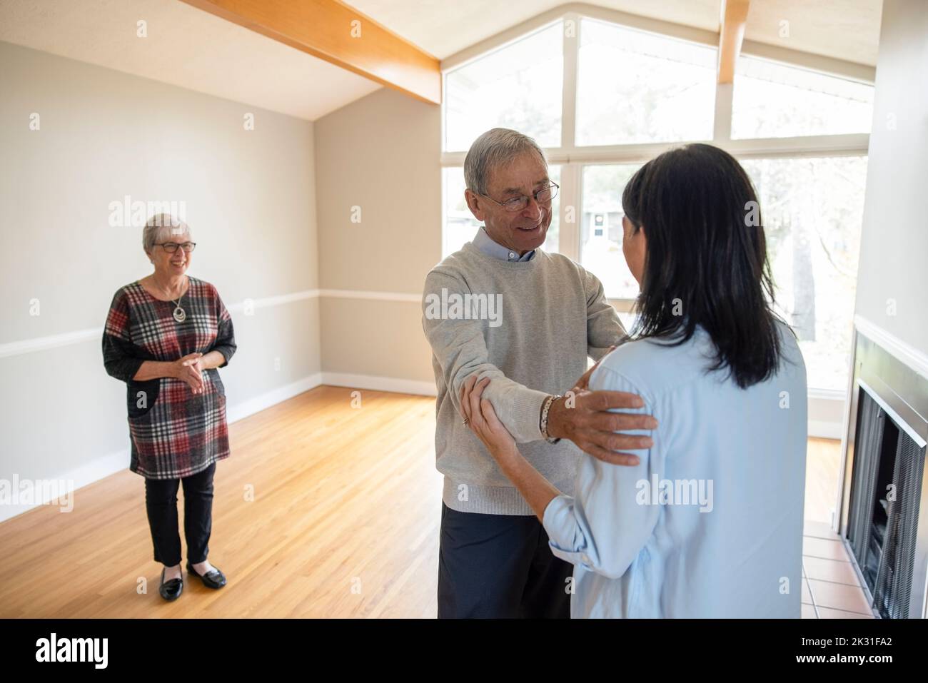 Affectionate daughter and senior father in new home Stock Photo