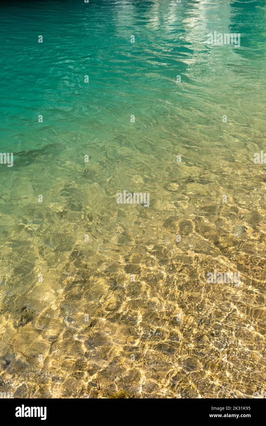Ripple water abstract background with small pebbles Stock Photo - Alamy
